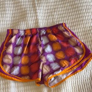 Nike Women’s Purple Polka‑Dot Running Shorts with Orange Trim